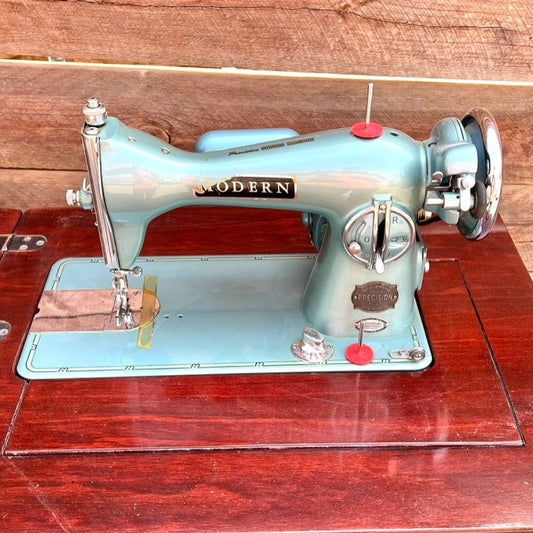 Sleek Modern Aqua Sewing Machine In Cabinet