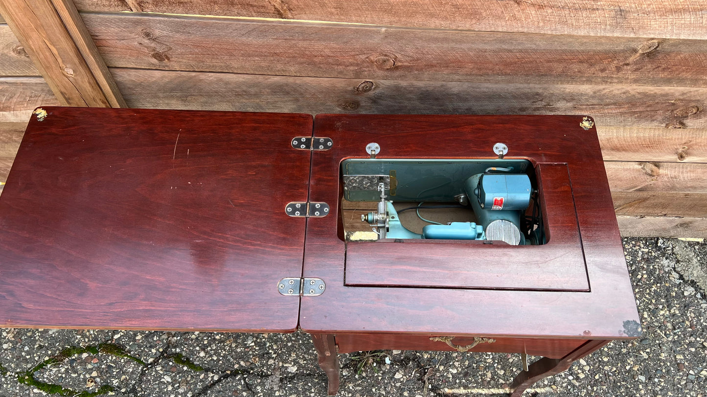 Sleek Modern Aqua Sewing Machine In Cabinet