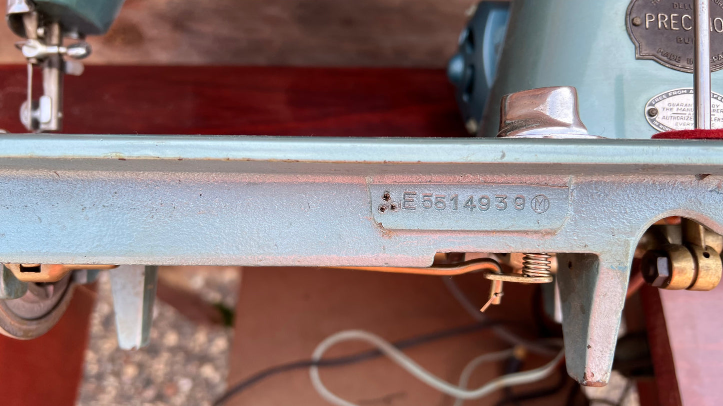 Sleek Modern Aqua Sewing Machine In Cabinet