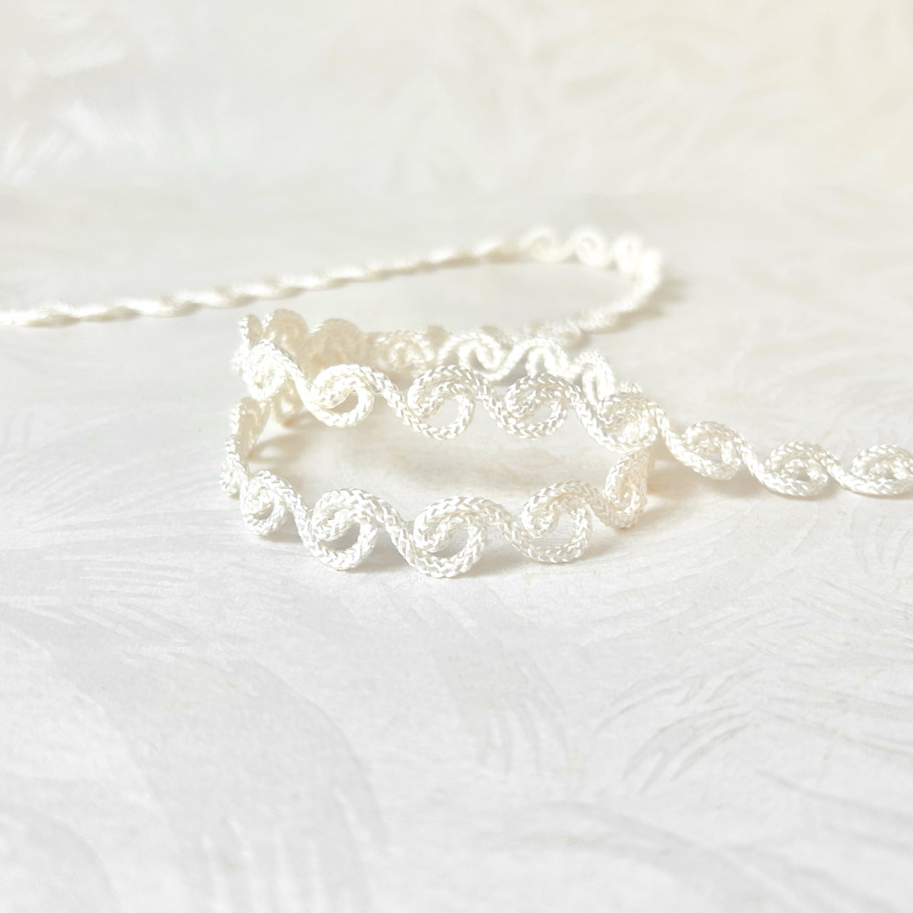 White_Scroll_Braid