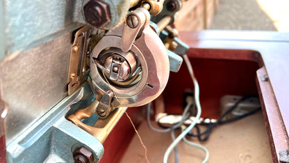 Sleek Modern Aqua Sewing Machine In Cabinet
